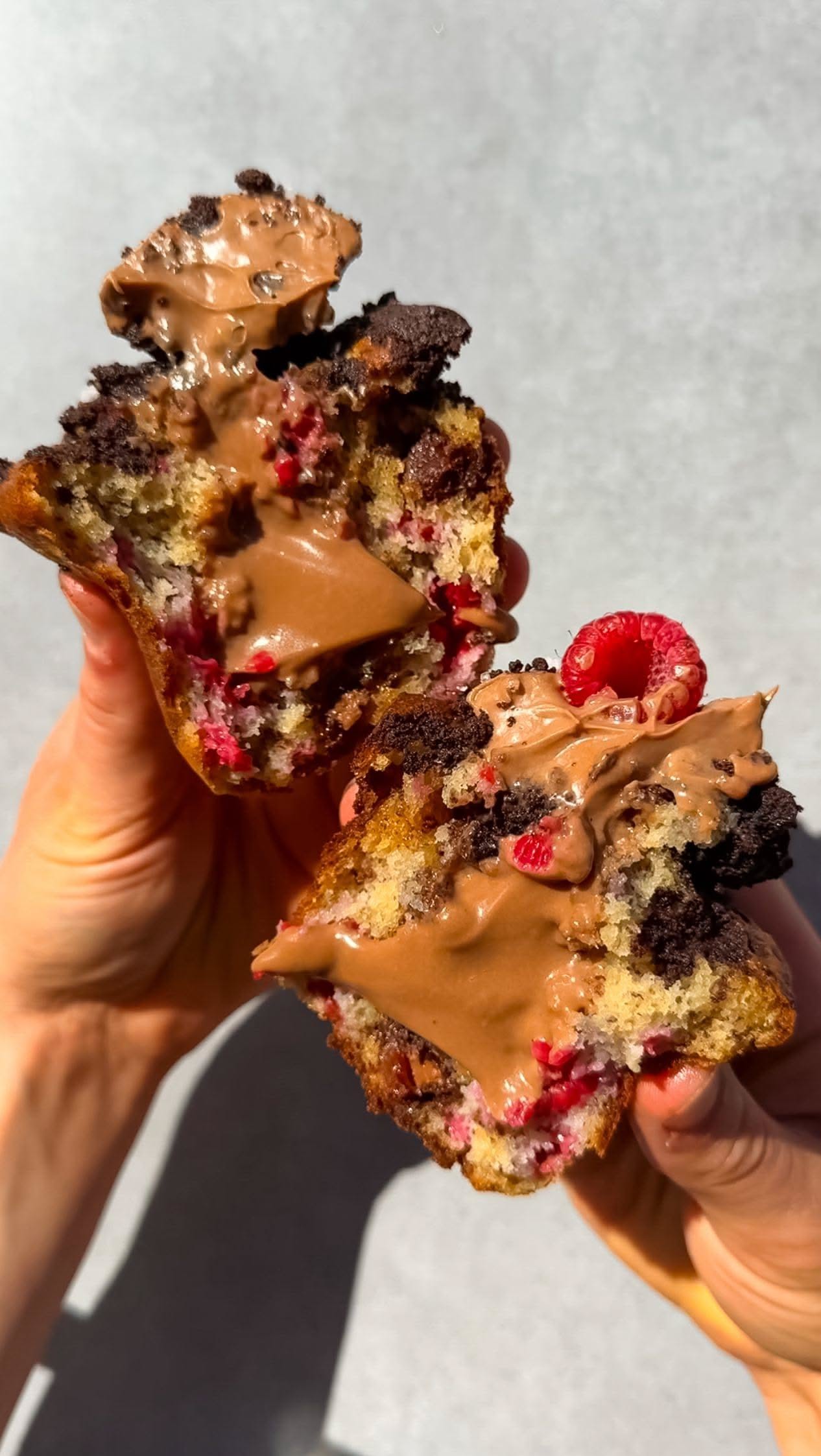 Soft and Moist Banana Muffins Packed with Raspberries and Chunks of Dark Chocolate