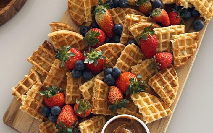 waffles with chocolate sauce and strawberries